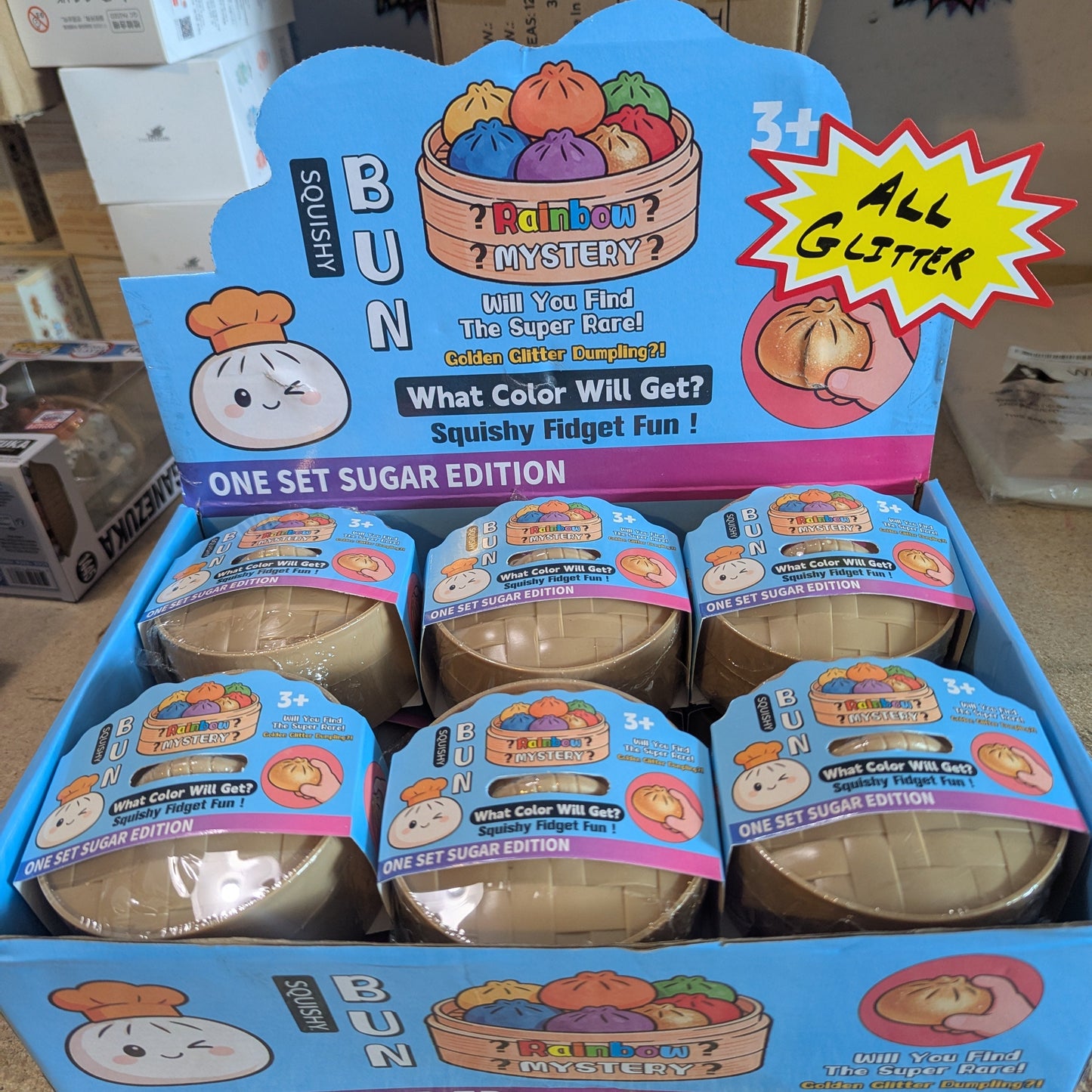Colorful glittery squishy bun mystery dumplings toy from Ralphie's Funhouse, soft and squeezable for stress relief.
