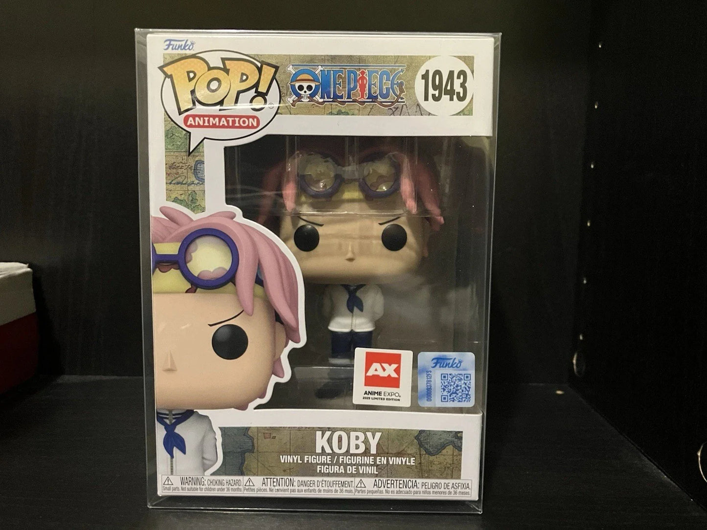 Anime Expo 2025 exclusive Pop! Animation One Piece Koby figure by Ralphie's Funhouse displayed on a clear stand with vibrant colors.