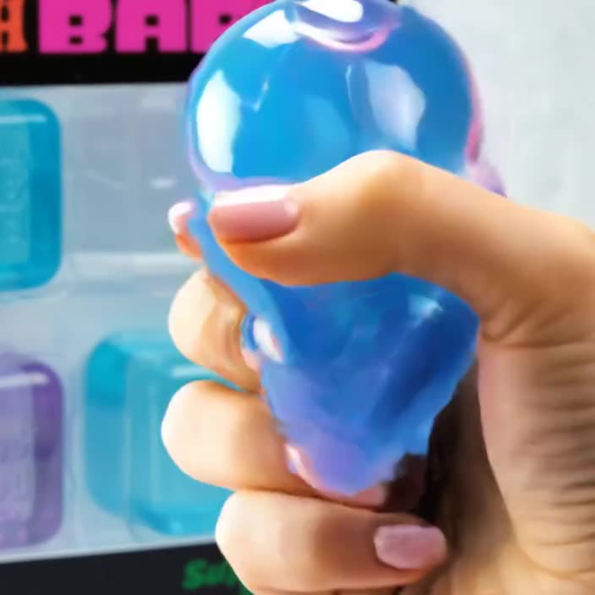 Nee Doh Nice Ice Baby super solid squish toy set in its original retail packaging, featuring four translucent ice cube-shaped toys in blue, pink, and purple.
