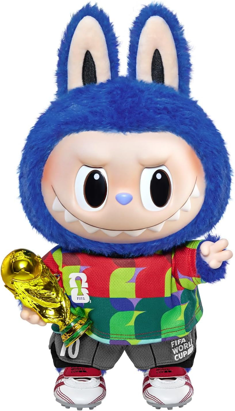 Toy figure with blue bunny ears holding a trophy, wearing a colorful outfit.
