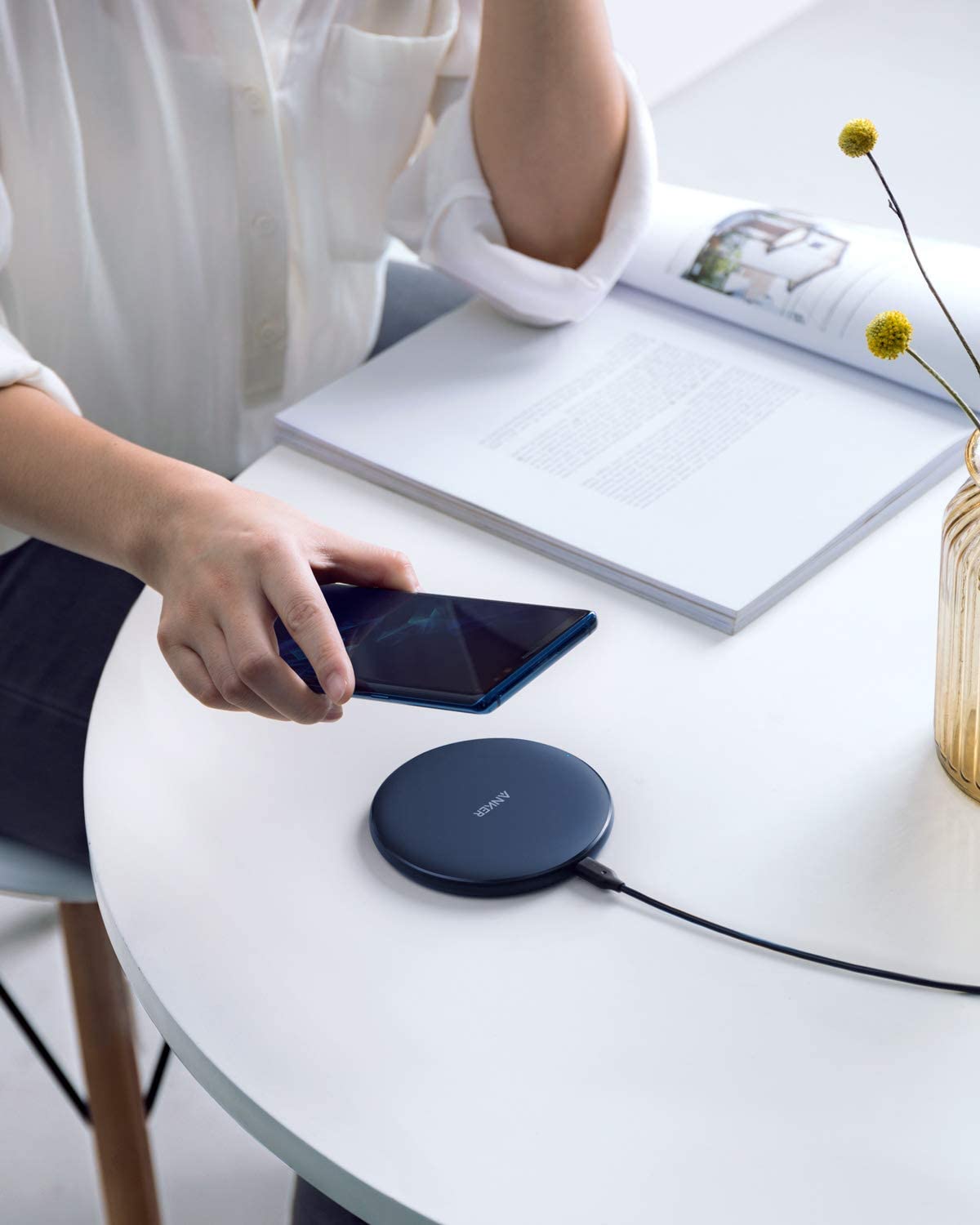Anker 313 wireless charging pad in black for fast and convenient charging of compatible smartphones.
