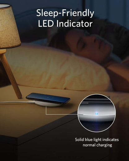 Black Anker 313 wireless charging pad for charging compatible devices wirelessly on a sleek, minimalist charging pad.