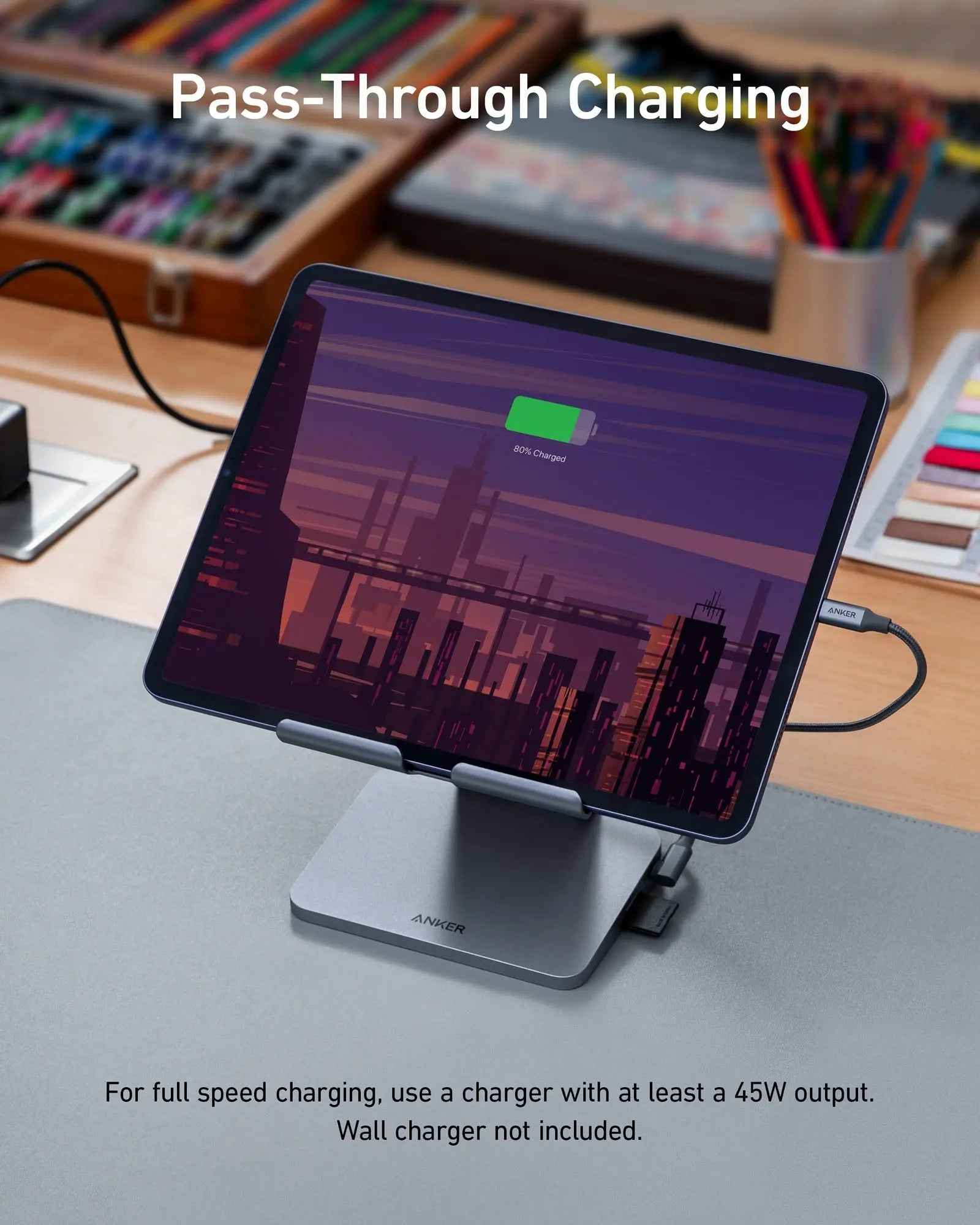 Anker 551 USB-C Hub in gray with 8-in-1 ports and tablet stand, designed for charging and connectivity.