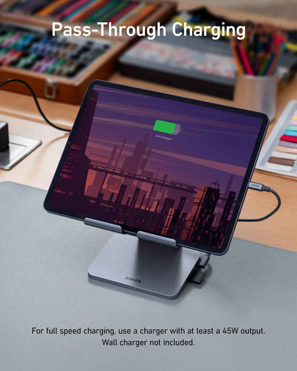 Anker 551 USB-C Hub in gray with 8-in-1 ports and tablet stand, designed for charging and connectivity.