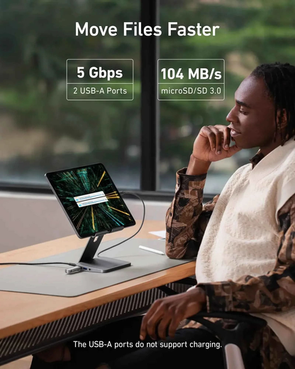 Anker 551 USB-C Hub in gray with 8-in-1 ports and tablet stand, designed for charging and connectivity.