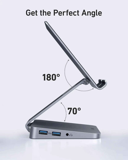 Anker 551 USB-C Hub in gray with tablet stand, showing multiple ports for charging and connectivity on a sleek device.