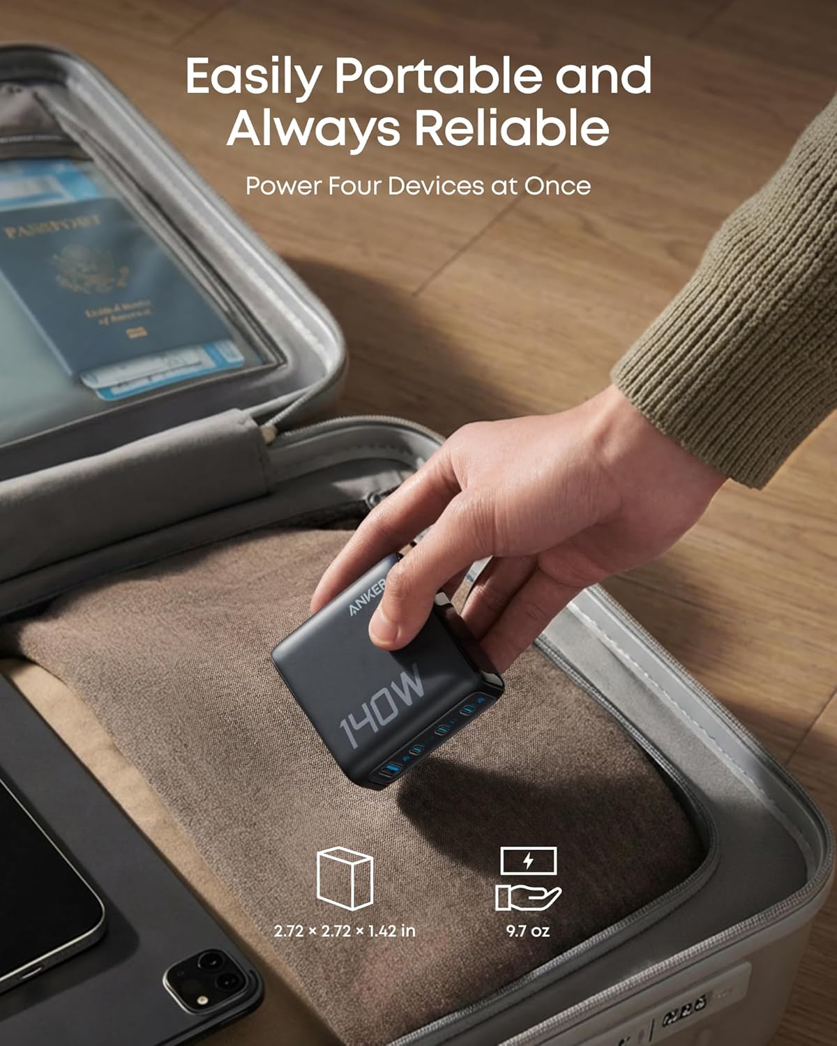 Anker 25K 165W laptop power bank in space black with built-in and retractable cables for portable charging.