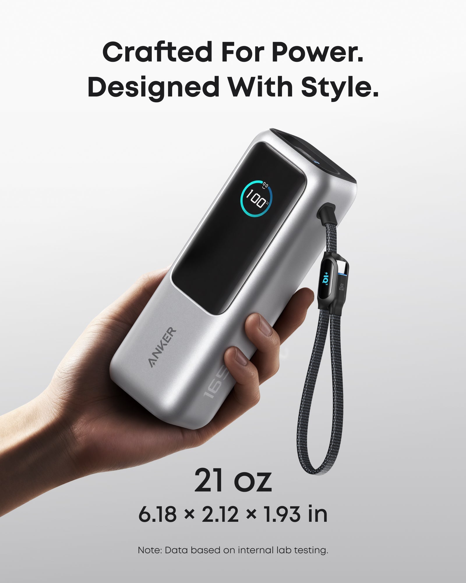 Anker 25K 165W laptop power bank in space black with built-in and retractable cables for portable charging and power supply.