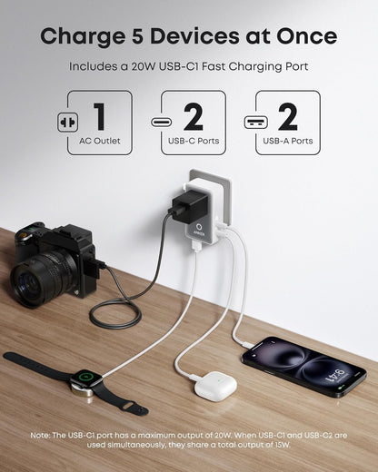 Anker 25K 165W laptop power bank with built-in and retractable cables in black, portable mobile charging device