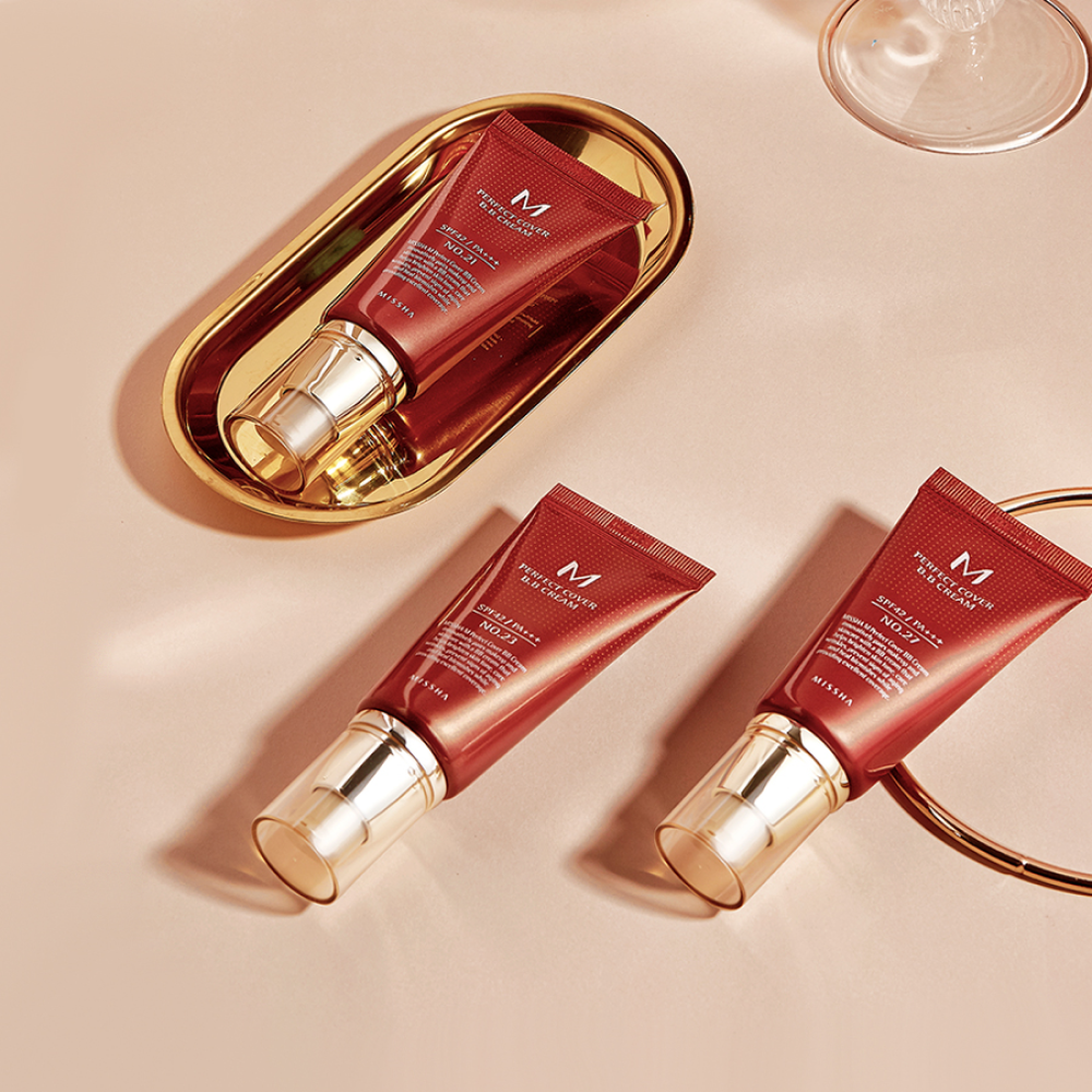 Missha M Perfect Cover BB Cream #27 Honey Beige in a foundation tube, showcasing smooth, natural beige shade for even skin tone.
