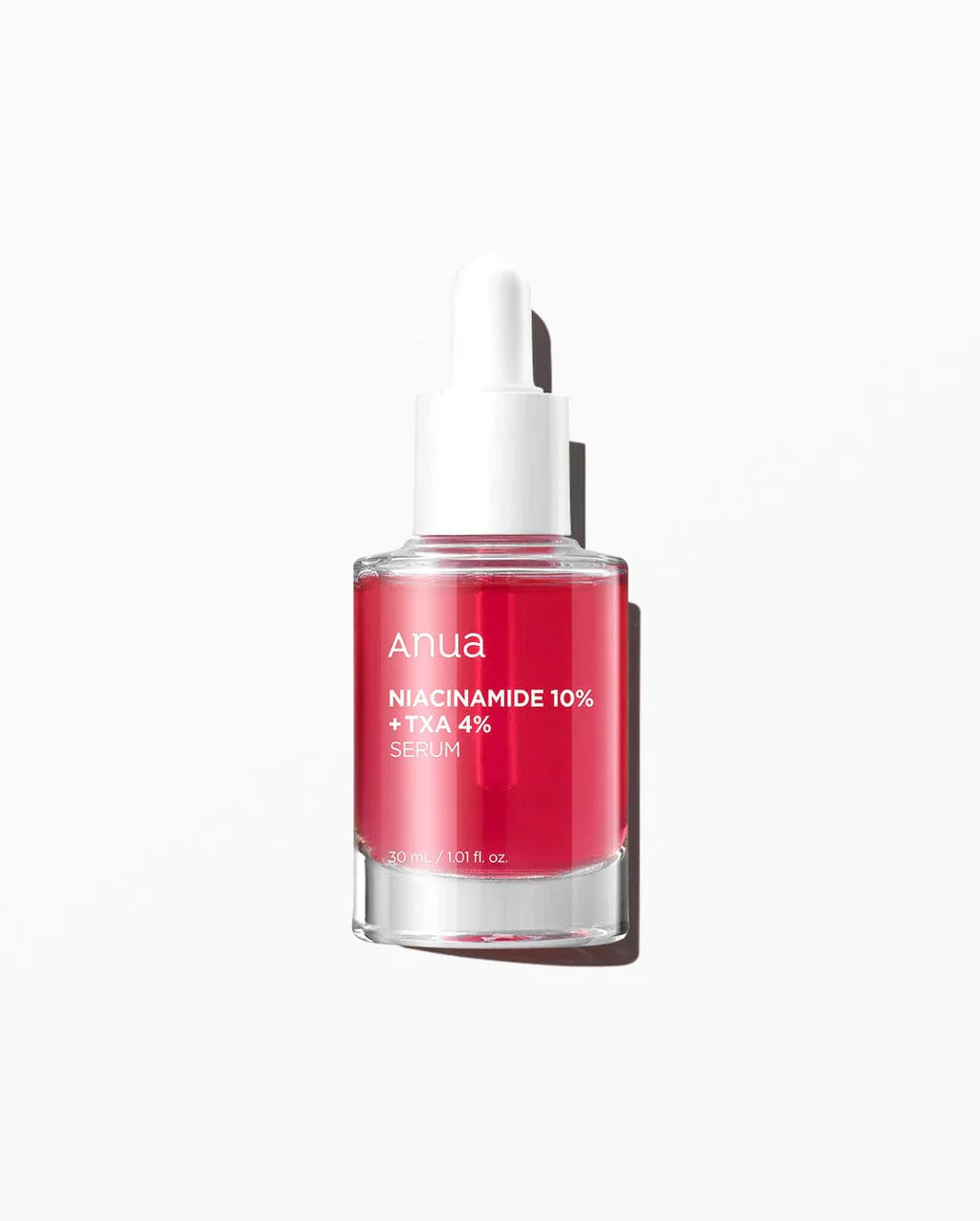 ANUA Niacinamide 10%+TXA 4% dark spot correcting serum in a clear glass bottle with a dropper, labeled with product details.