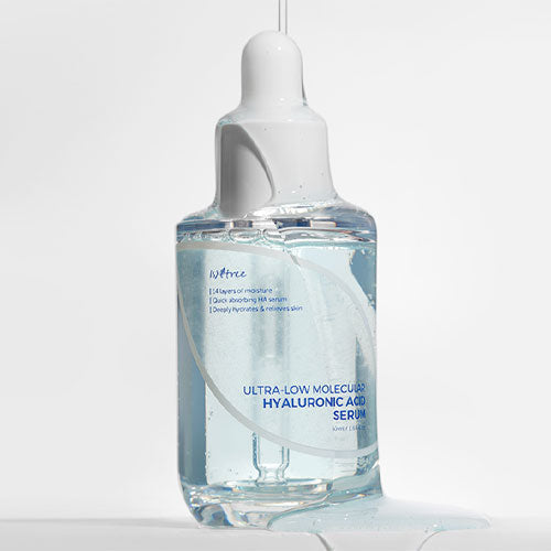 Isntree Ultra-Low Molecular Hyaluronic Acid Serum in a clear glass bottle with a white pump dispenser, labeled with product details.