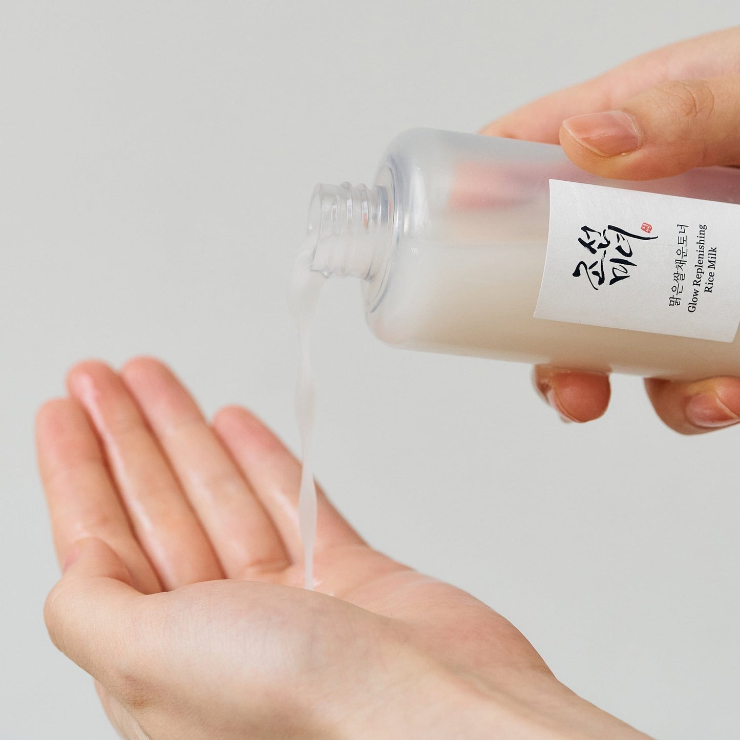 Beauty of Joseon Glow Replenishing Rice Milk toner lotion in a clear bottle with rice milk formula and natural ingredients.