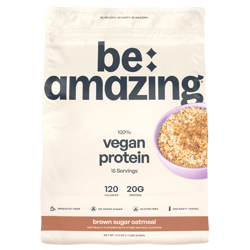 Be Amazing vegan protein powder with Dole Whip Strawberry flavor, showing the colorful packaging and serving size details.