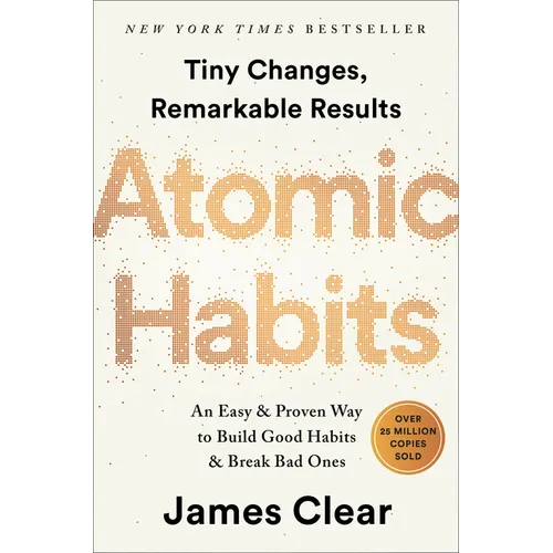 Hardcover book titled "Atomic Habits" by splitShops, showing the cover with title and author details.