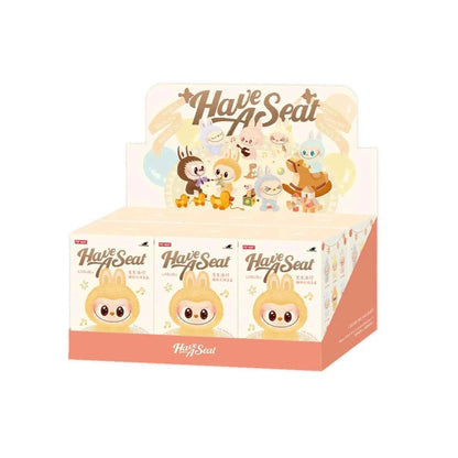 BuBu Craze Pop Mart Labubu Have a Seat blind box featuring a colorful Labubu character sitting on a seat, with playful design and vibrant colors.