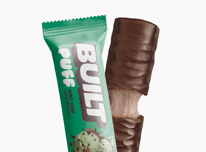 Built BUILT Mint Chip Puff snack, showing the soft, mint-flavored puff with chocolate chips in a clear wrapper.