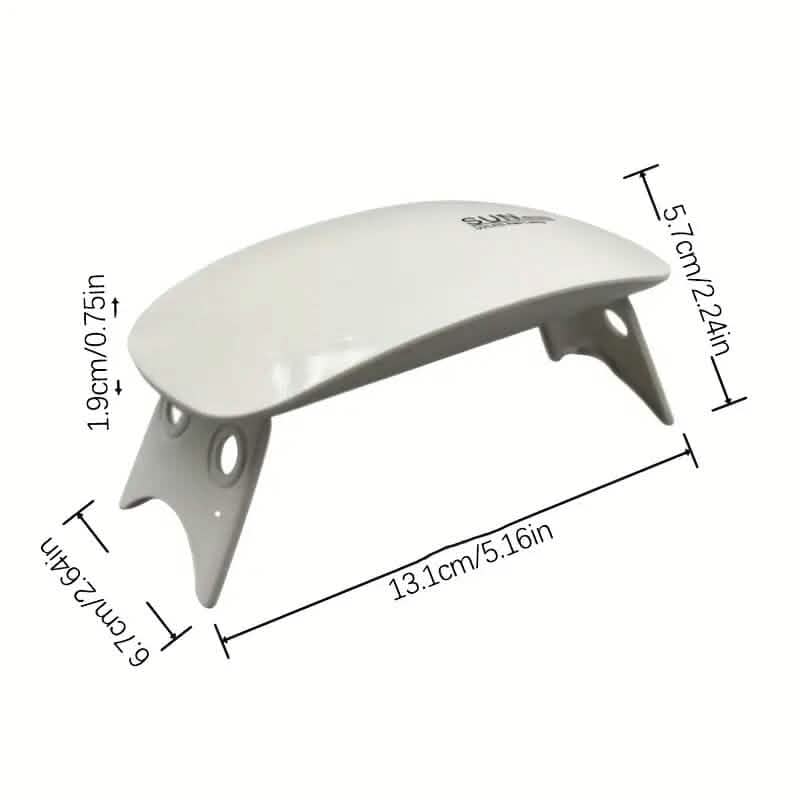 Mini UV/LED nail dryer with three LED lights, compact design for quick and efficient nail curing in beauty and personal care.