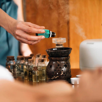 Three DC-PURSONIC aromatherapy essential oils bottles featuring lavender, eucalyptus, and frankincense scents.