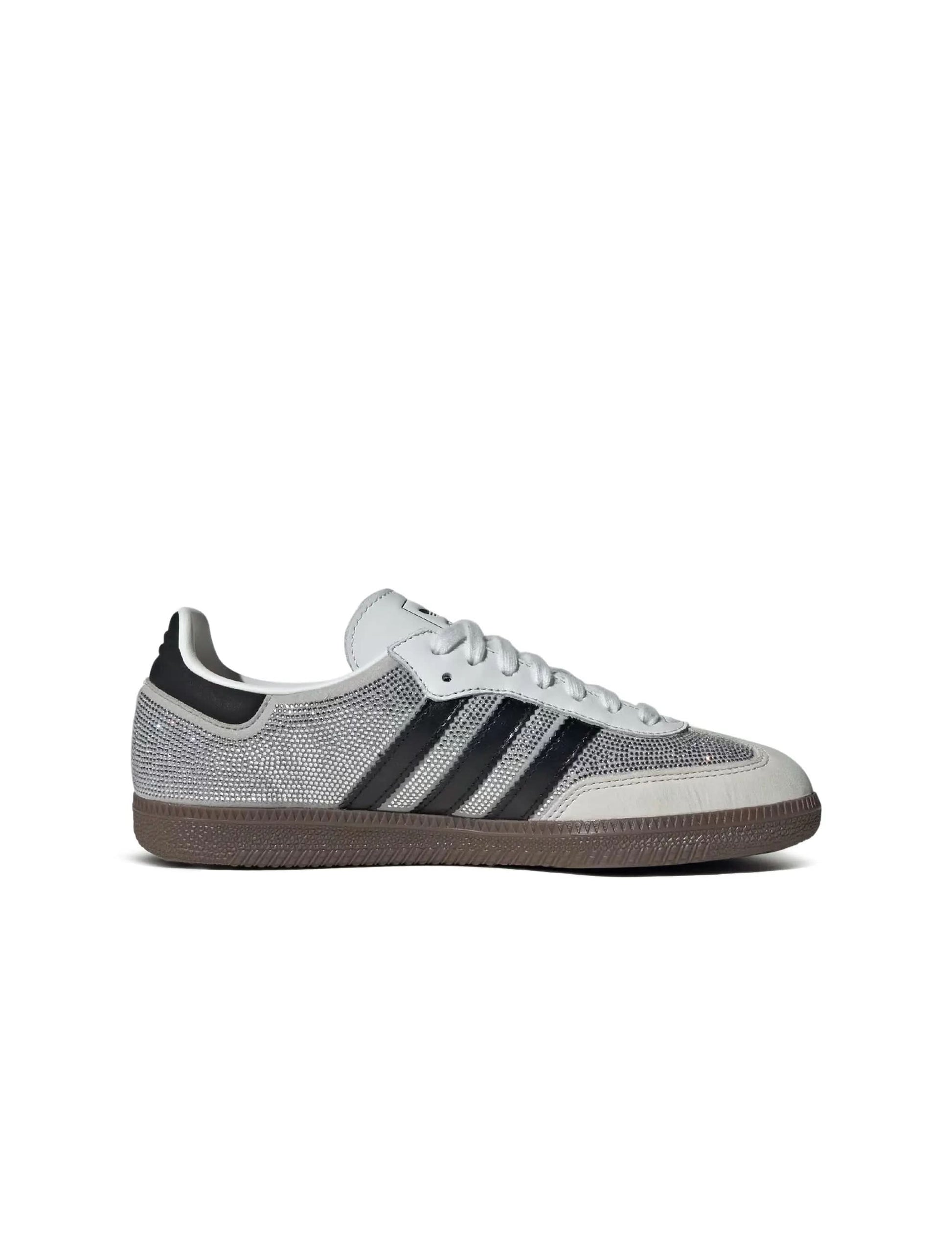 White Adidas Women's Samba OG sneakers with rhinestone accents, showcasing classic footwear design and stylish details.