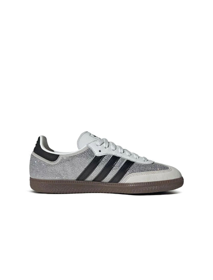 White Adidas Women's Samba OG sneakers with rhinestone accents, showcasing classic footwear design and stylish details.