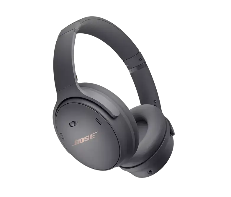 Black Bose QuietComfort 45 headphones resting on a surface, showcasing their sleek over-ear design and padded ear cups.