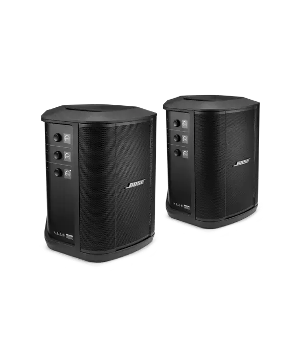 Pair of Bose S1 Pro+ portable Bluetooth speaker systems with integrated handles and control panels for mobile sound setup.