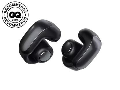 Black Bose Ultra Open Earbuds shown with open-ear design and sleek fit, designed for comfortable, immersive sound.