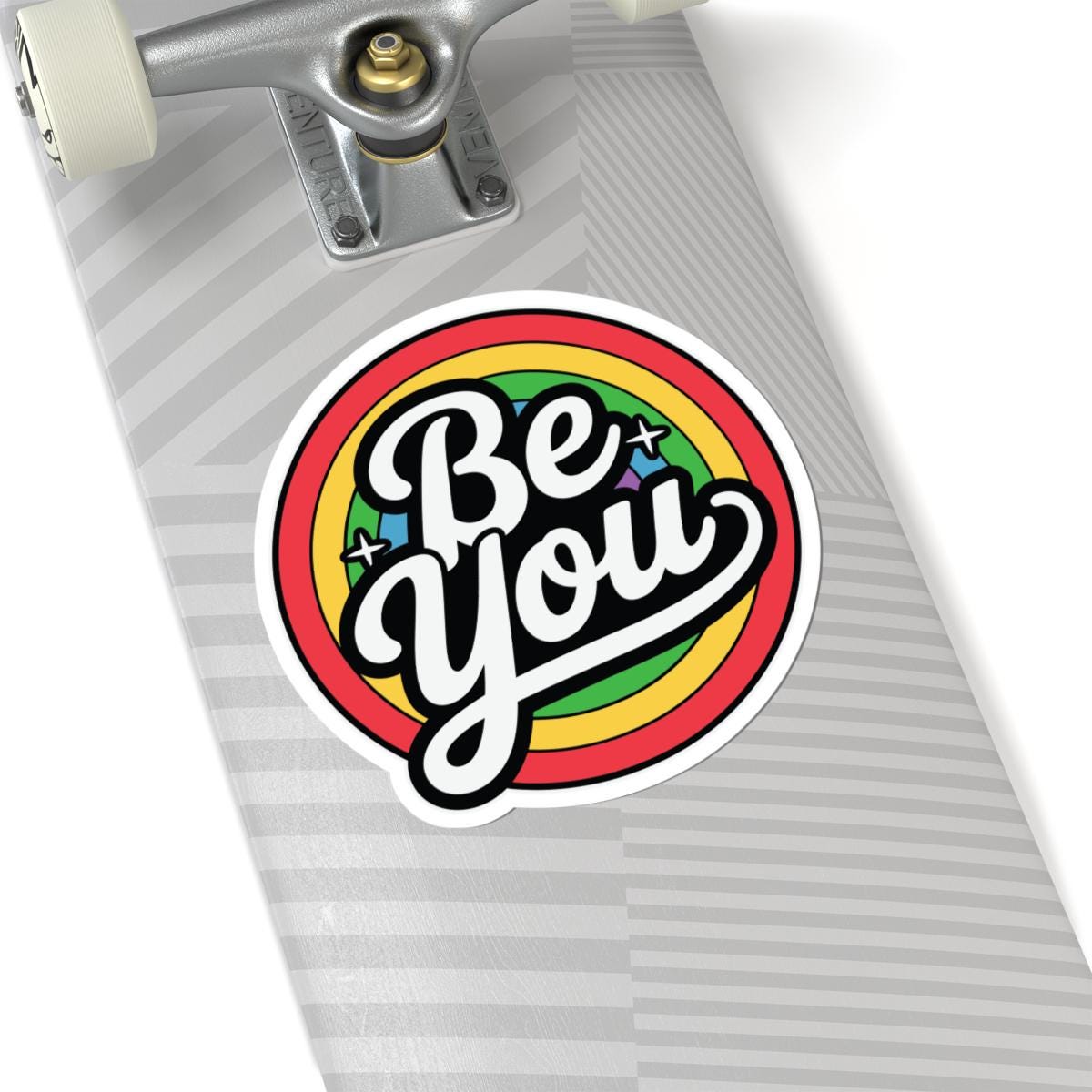 Glossy rainbow sticker with "Be You" message, perfect for LGBTQ+ pride vinyl decor, featuring vibrant colors and a glossy finish.