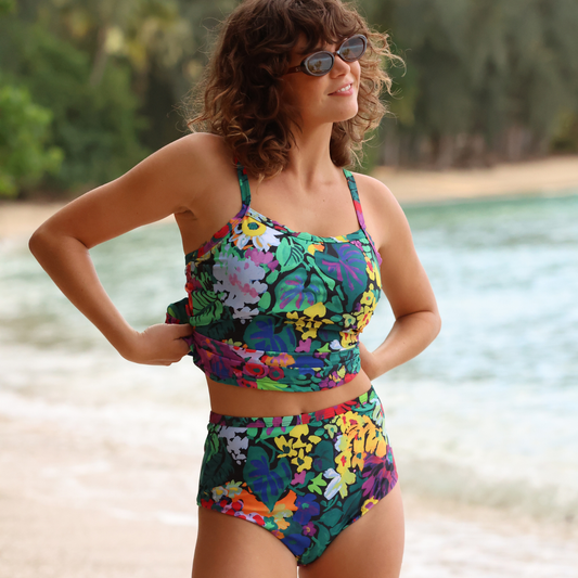 Black women's tankini swimsuit with two-piece design, featuring a fitted top and matching bottoms, perfect for swimwear occasions.