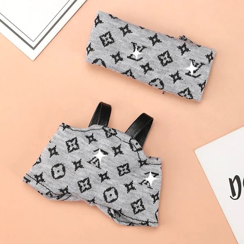 Black Labubu Posh Monogram Sleek Romper outfit set displayed on a hanger, featuring a stylish, fitted design with Monogram pattern.