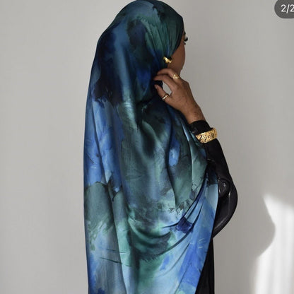 Mariams Collection satin hijab with elegant marble print in soft tones, 180cm length, smooth satin fabric.