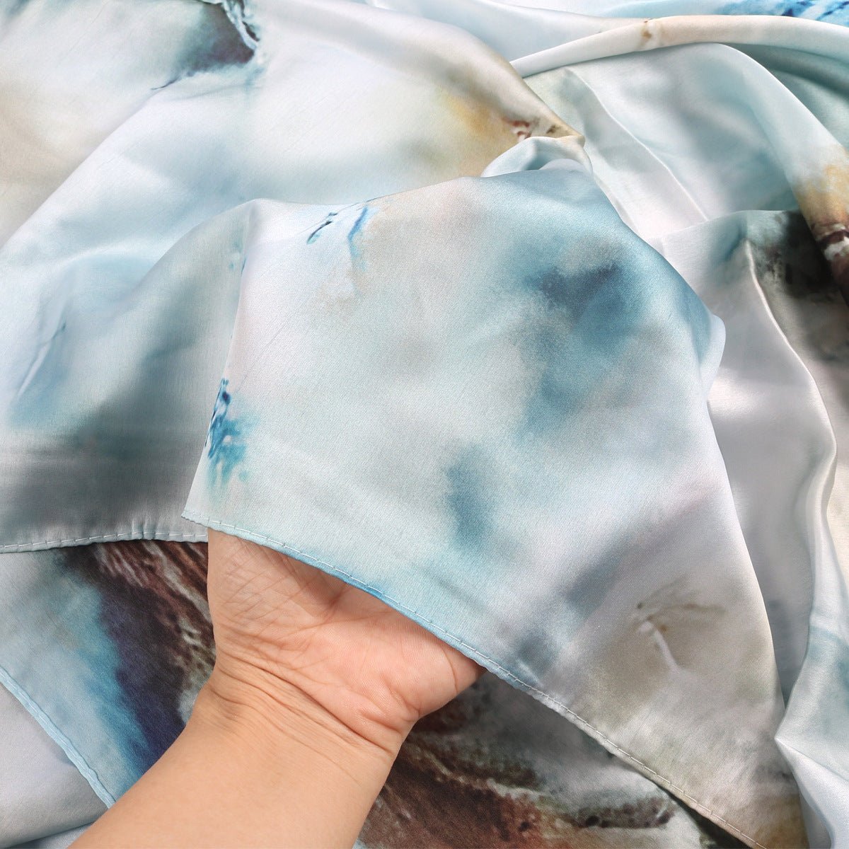 Mariams Collection satin marble print hijab in elegant design, showcasing smooth satin fabric and stylish marble pattern.