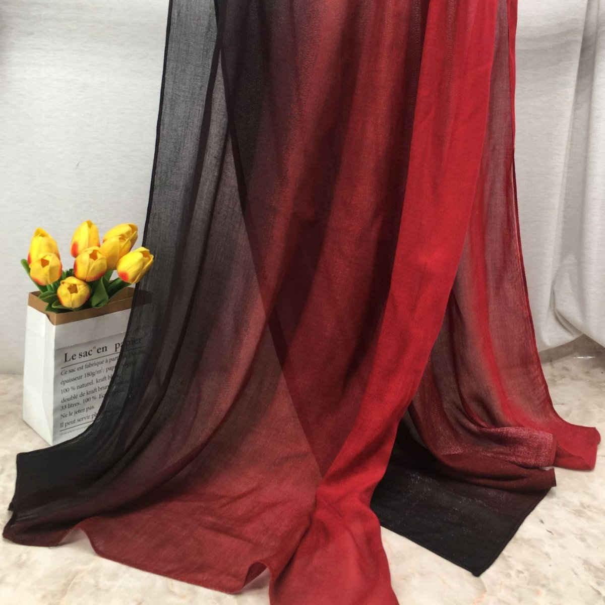 Lightweight breathable gradient shawl hijab from Mariam's Collection, shown in soft pastel shades with flowing fabric.