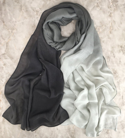 Modal gradient soft hijab with color transition in natural flow, from Mariam's Collection, shown in a flowing fabric style.