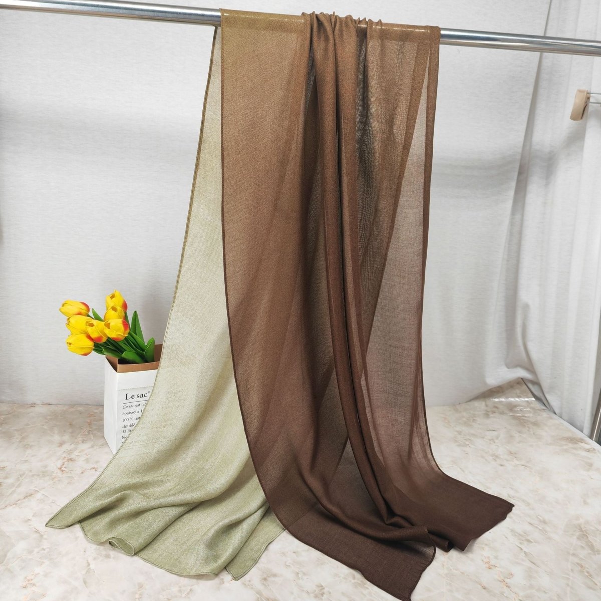 Modal gradient soft hijab with color transition and natural flow by Mariam's Collection, shown in a flowing fabric style.