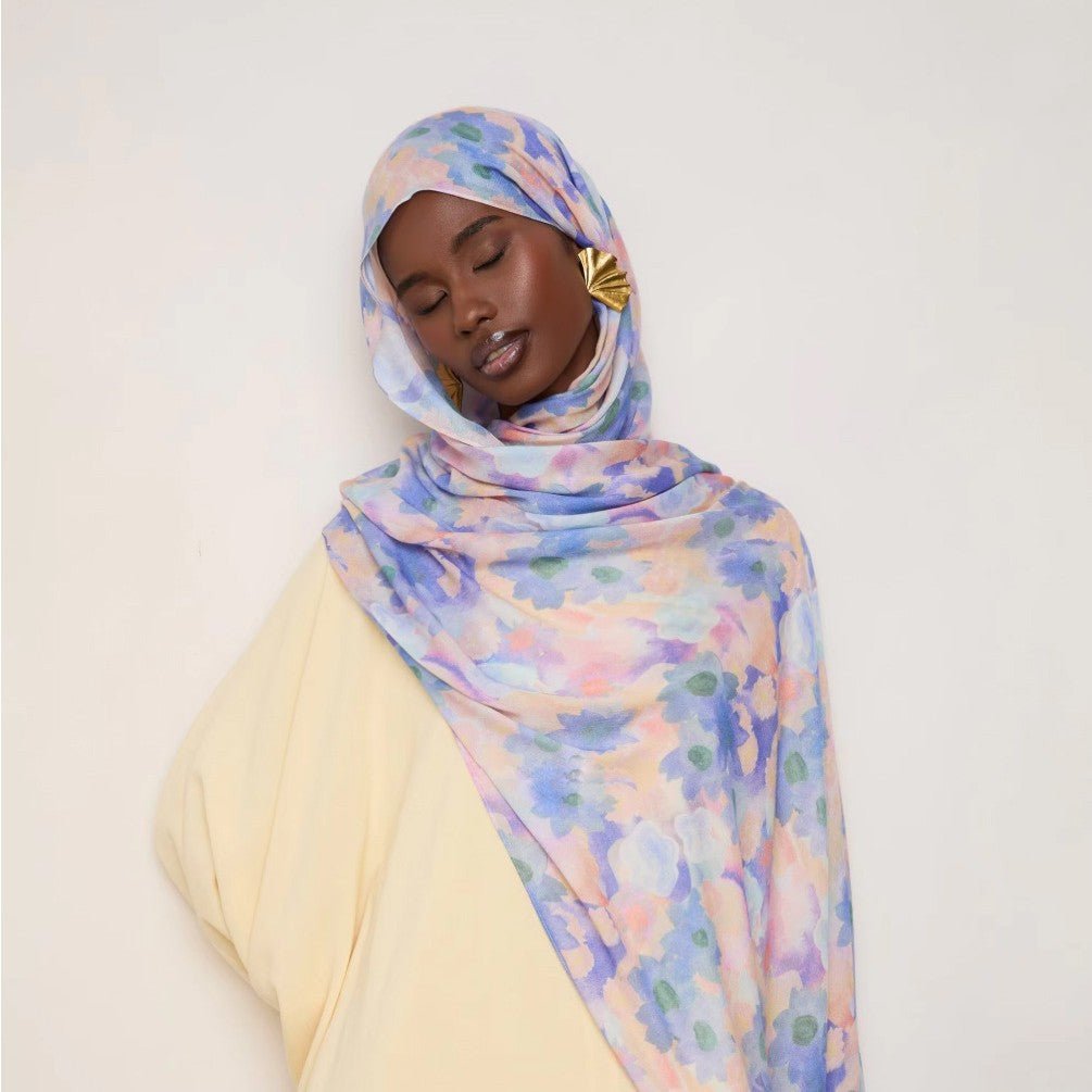 Vibrant floral print lightweight hijab scarf from Mariam's Collection, botanical design, soft fabric, versatile headscarf.