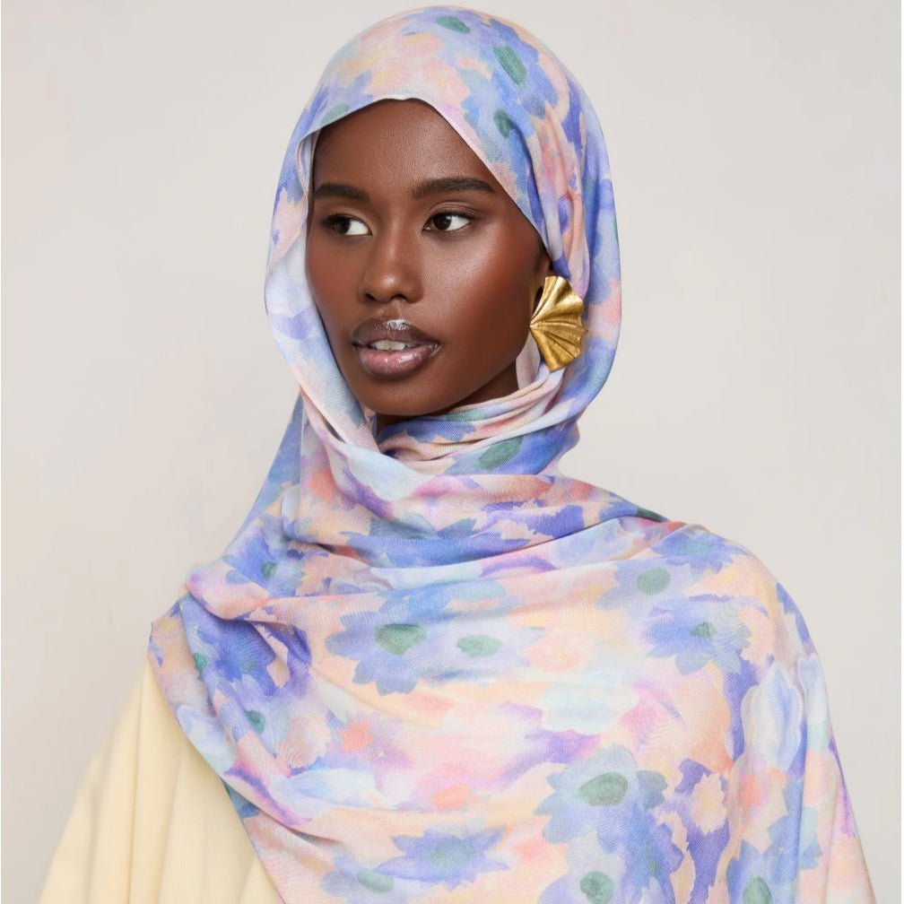 Vibrant floral print hijab scarf by Mariam's Collection, lightweight botanical headscarf in bright colors and soft fabric.