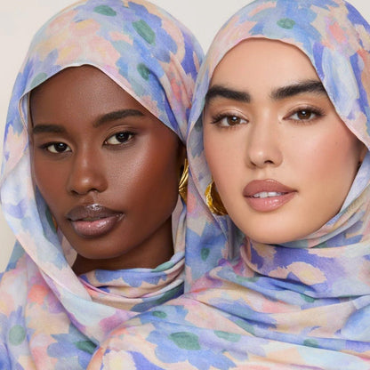 Vibrant floral print Mariam's Collection lightweight hijab scarf with botanical design, 180x70cm, displayed flat on a white background.