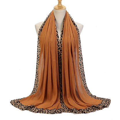Black leopard-print embellished crinkle hijab scarf from Mariam's Collection, 70x180cm, featuring solid color and stylish design.