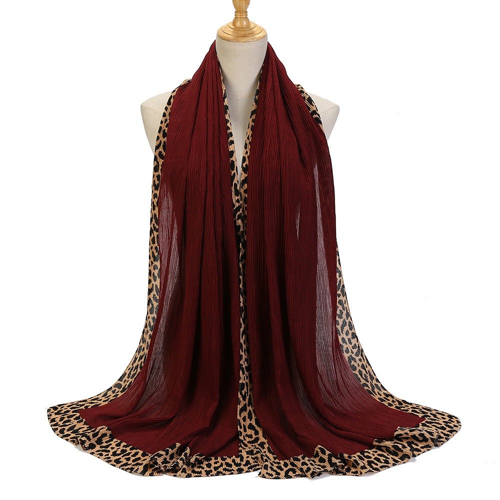 Black leopard-print embellished crinkle hijab scarf by Mariam's Collection, featuring solid color design and decorative details