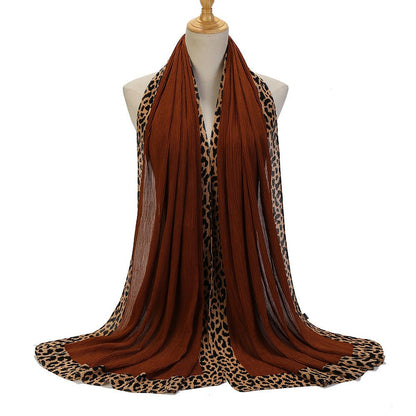 Black crinkle hijab with leopard print embellishments, solid color scarf from Mariam's Collection, 180cm long.
