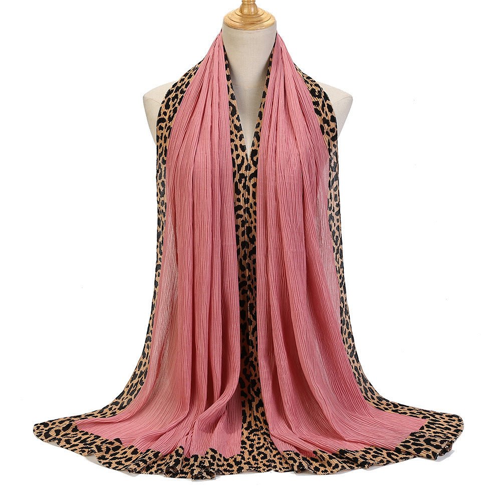 Black leopard-print embellished crinkle hijab scarf from Mariam's Collection, featuring a solid color and lightweight crinkle fabric.