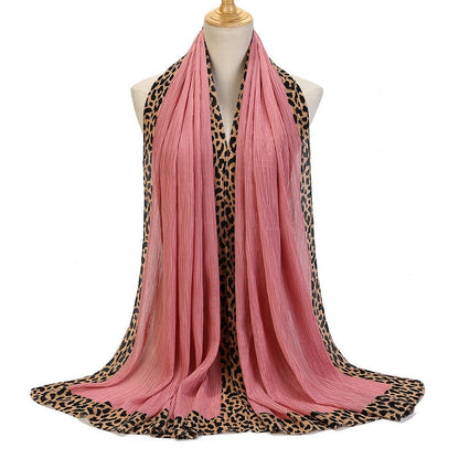 Black leopard-print embellished crinkle hijab scarf from Mariam's Collection, featuring a solid color and lightweight crinkle fabric.