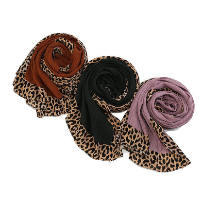 Black leopard-print crinkle hijab scarf with embellishments by Mariam's Collection, 180cm long, stylish and versatile accessory.