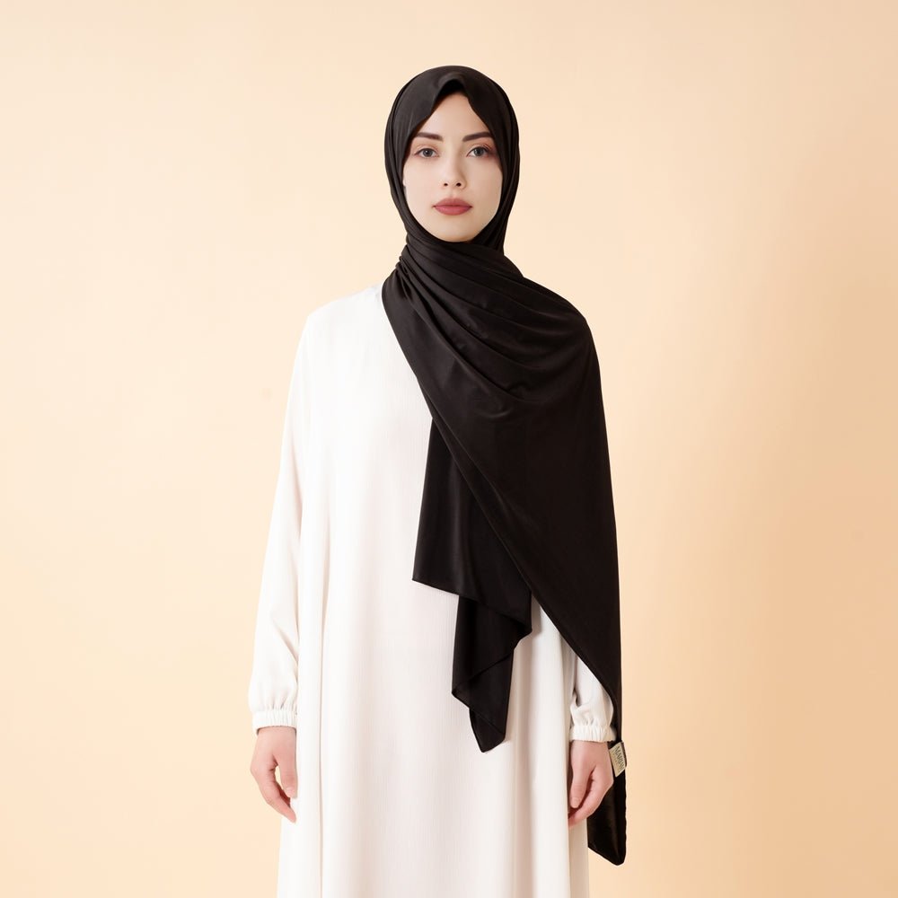 Jet black Mariam's Collection premium cooling non-slip hijab, breathable sports hijab, free size, comfortable for active wear.