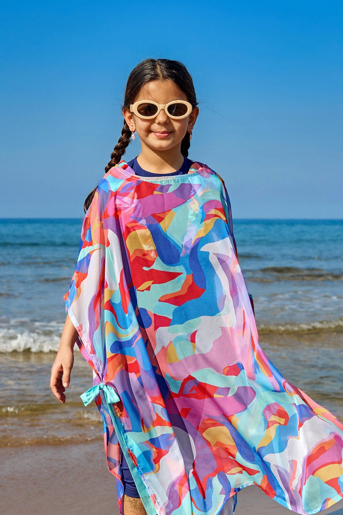 Colorful chiffon kimono beach cover-up for girls by Marina Modest, worn over a swimsuit, with a lightweight, flowy design.