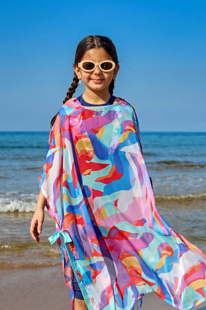 Colorful chiffon kimono beach cover-up for girls by Marina Modest, worn over a swimsuit, with a lightweight, flowy design.