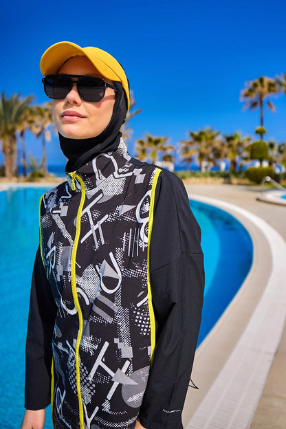 Black full coverage modest swimwear burkini set by Marina Modest, tam kapalı mayo with long sleeves and full-body coverage.