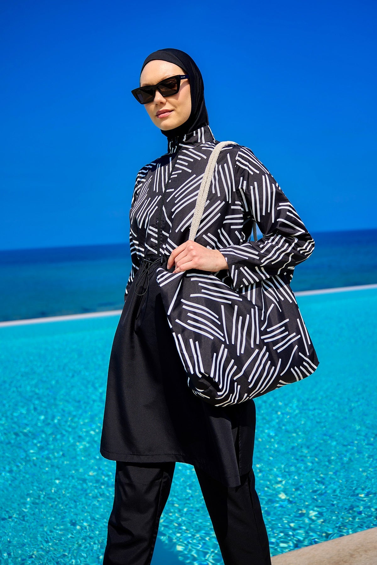 Black full coverage modest swimwear set for women by Marina Modest, featuring a tam kapalı mayo design.